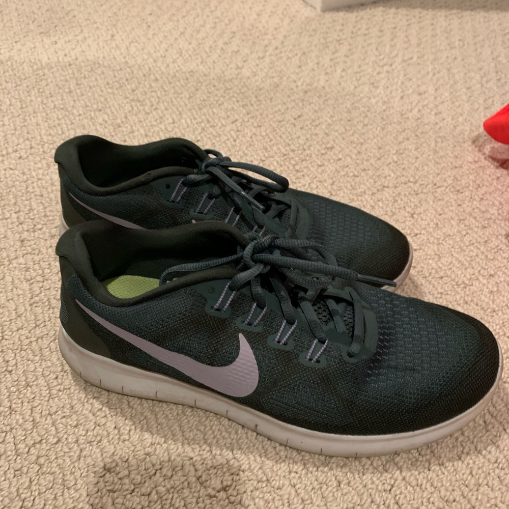 Minimally used Nike free run in dark green